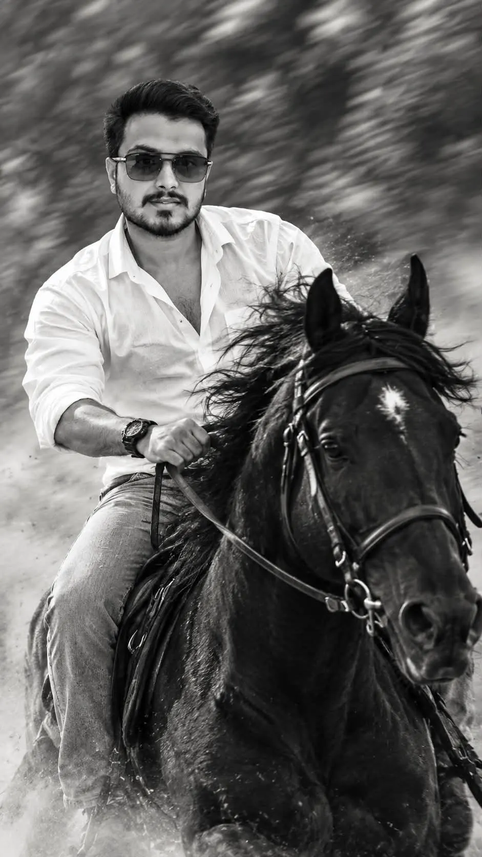 cinematic photo of a young man riding a black horse