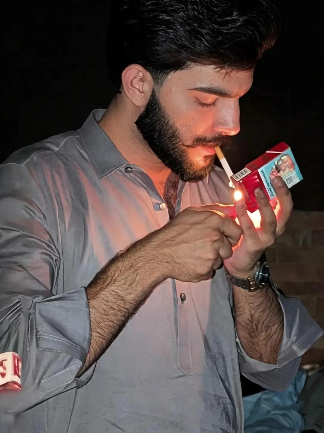 A Man Lighting a Cigarette in the Dark 🔥