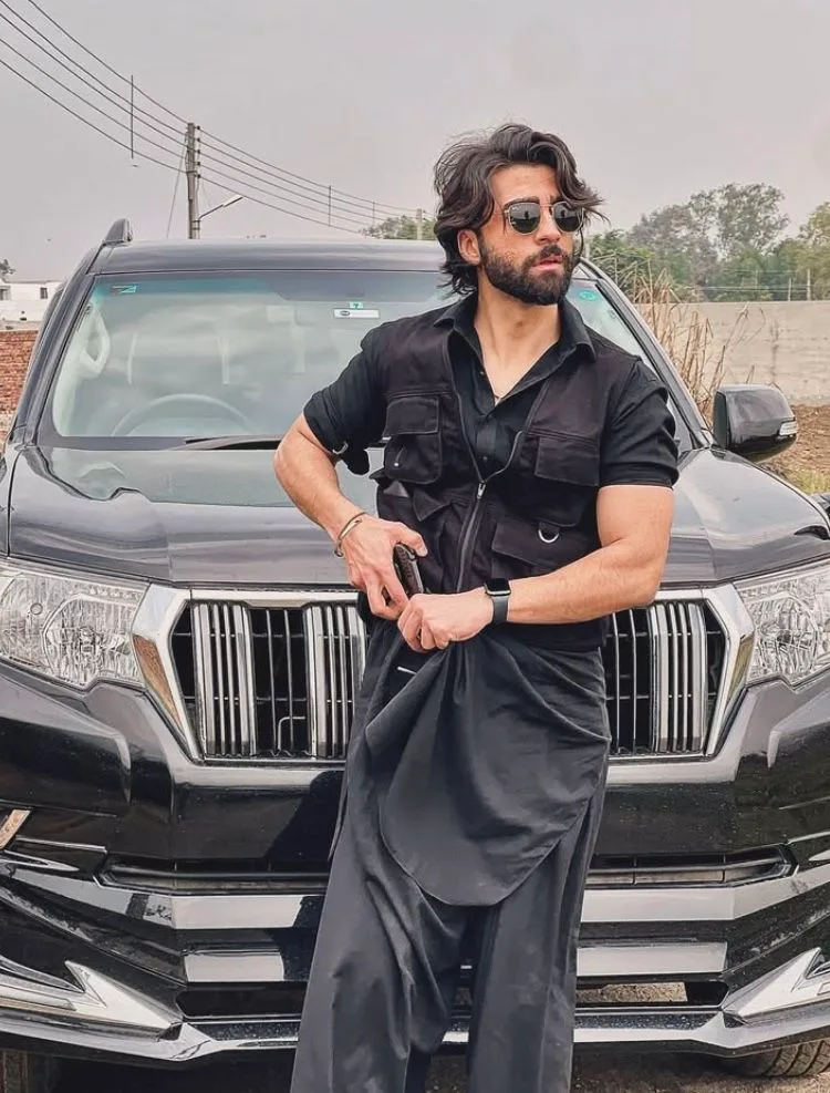 Bold Black Streetwear Look in Front of Luxury SUV