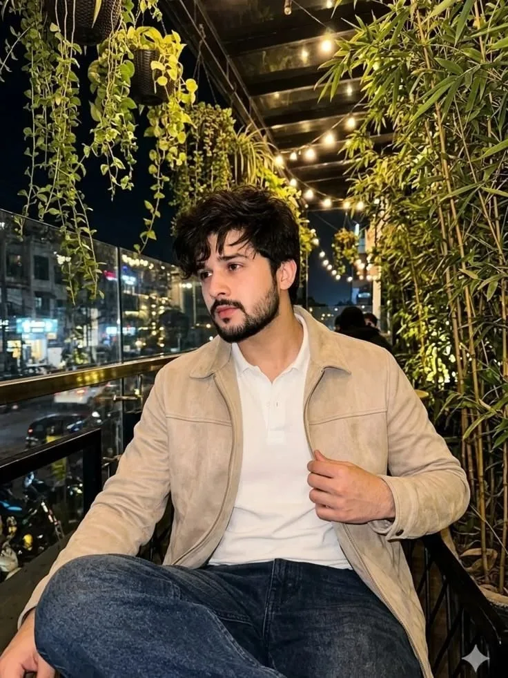 man sitting on a balcony