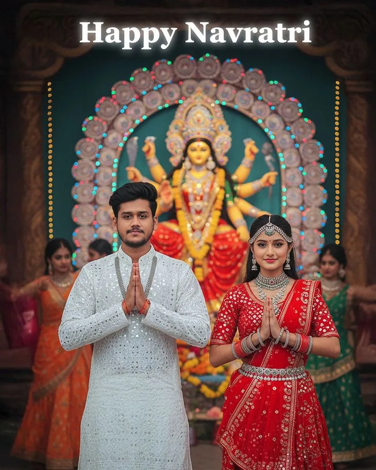 Devotional Navratri Portrait of Young Couple in White and Red Festive Attire in Namaste Pose Before Maa Durga