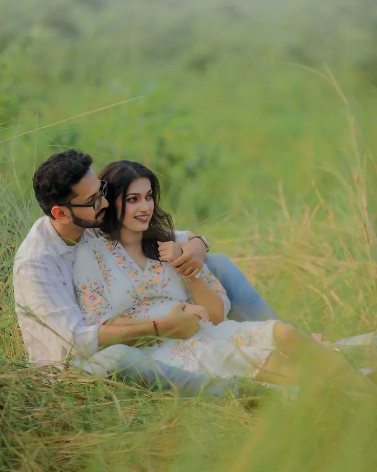 Romantic Candid Outdoor Portrait of Indian Couple Reclining in Grassy Meadow