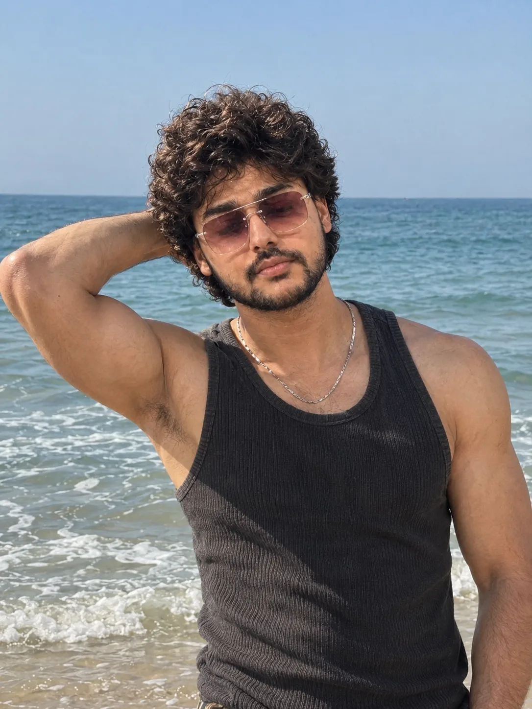 A stylish beach portrait of a young man