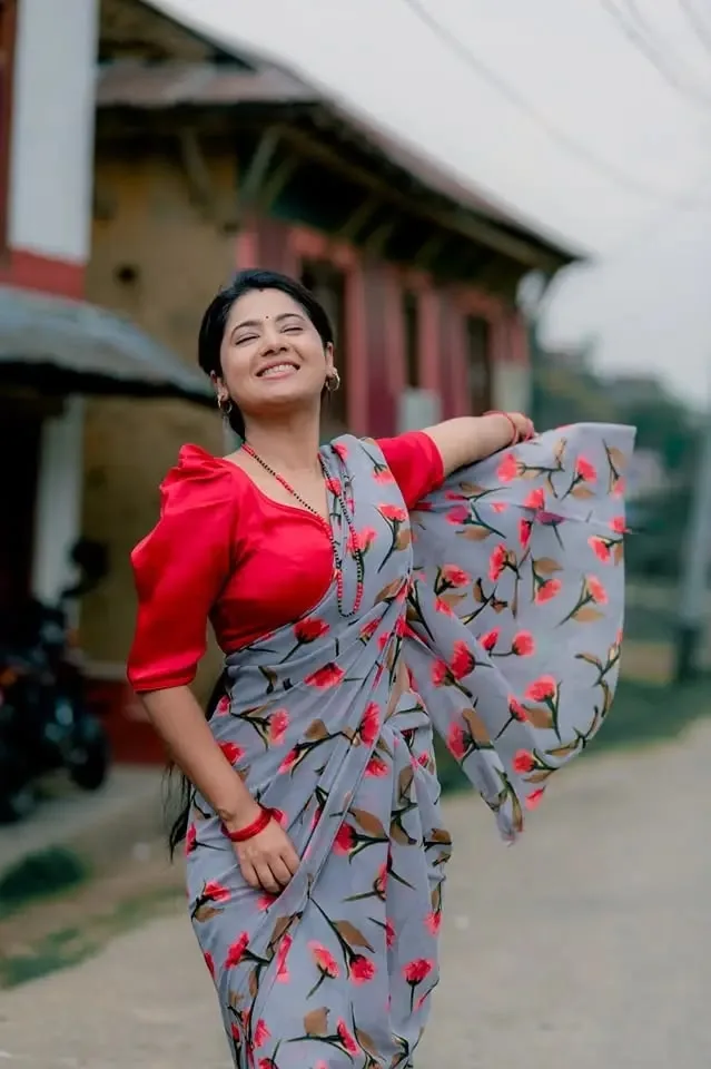 Candid Village Street Portrait of Joyful Indian Woman in Floral Saree