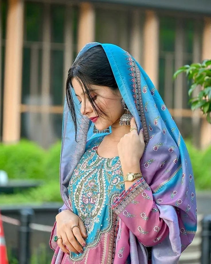 Candid Woman in Cyan and Lilac Salwar Kameez with Draped Dupatta
