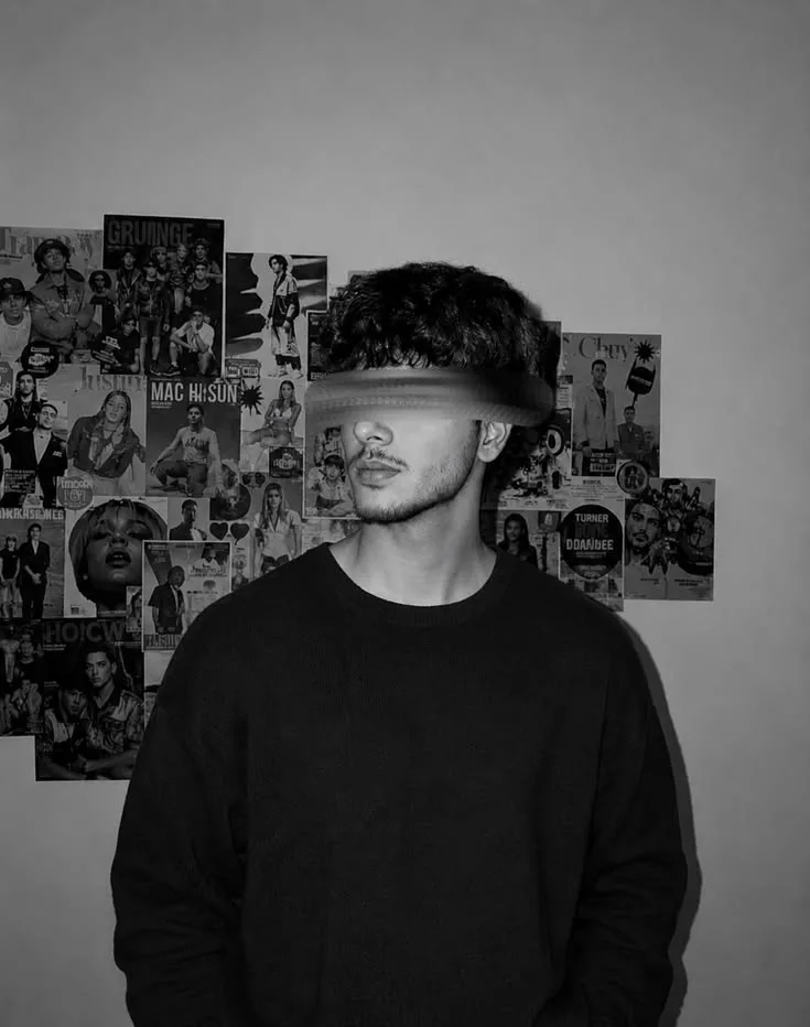 Moody Monochrome Indoor Portrait of Young Indian Man with Motion-Blurred Eyes