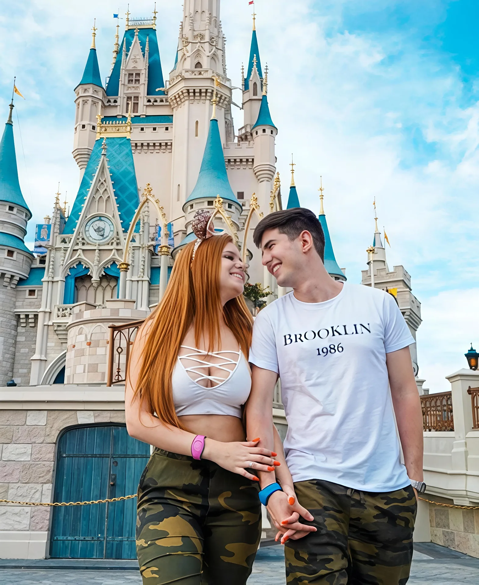 Candid Theme Park Couple Portrait Walking Hand-in-Hand in Front of Fairytale Castle