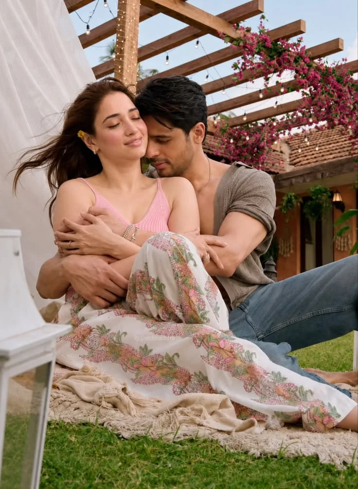 Romantic Couple in Boho Attire Embracing on Lawn Under Pergola