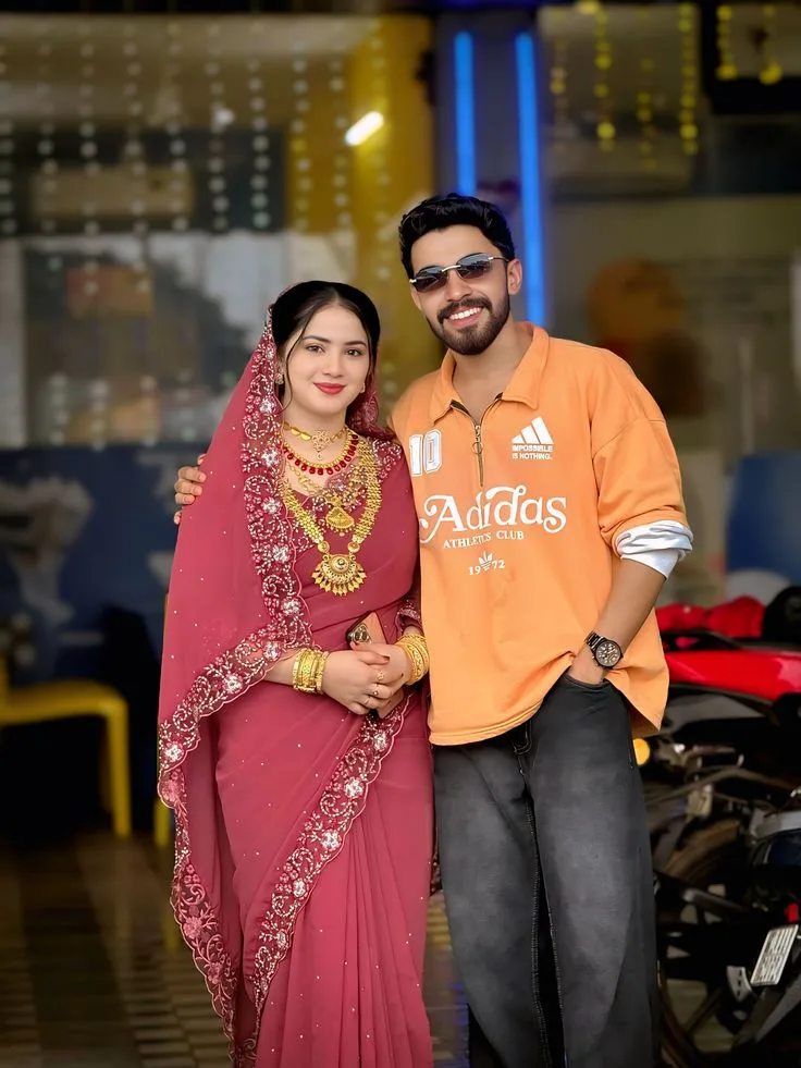 Candid Indian Couple Portrait in Dusky Rose Saree and Orange Streetwear Hoodie