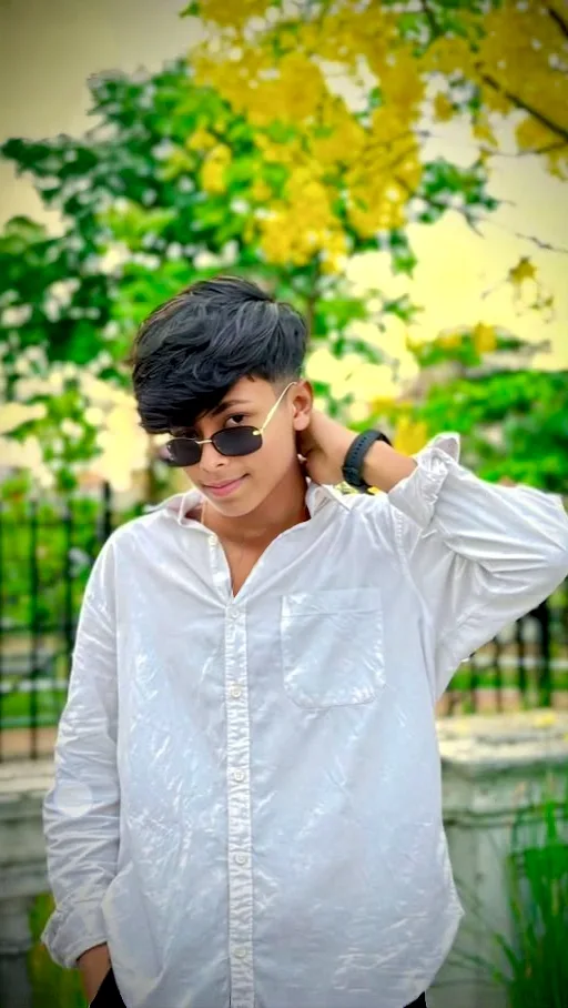 Candid Outdoor Portrait of Young Indian Boy in Oversized White Shirt