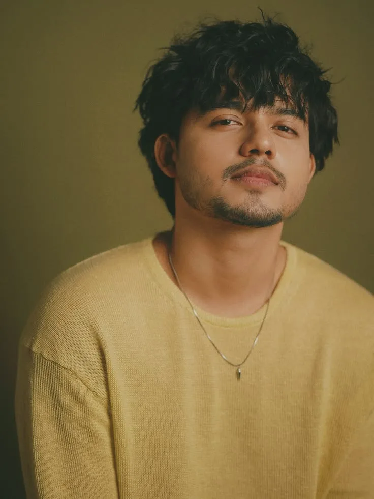 Intimate Studio Chest-Up Portrait of Young Indian Man in Yellow Knit Sweater
