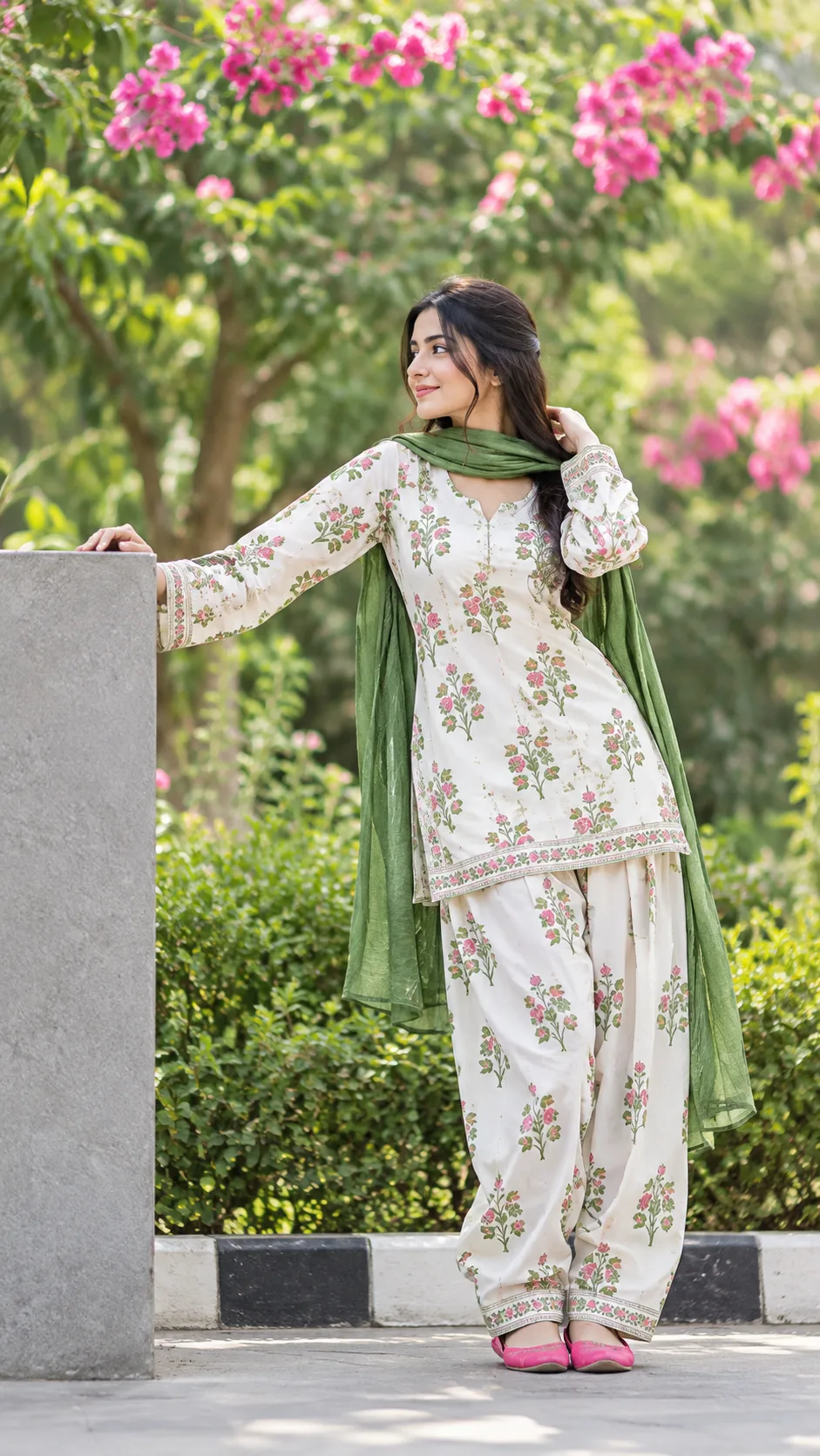 Vibrant Floral Outfit Portrait of a Woman in a Green Garden