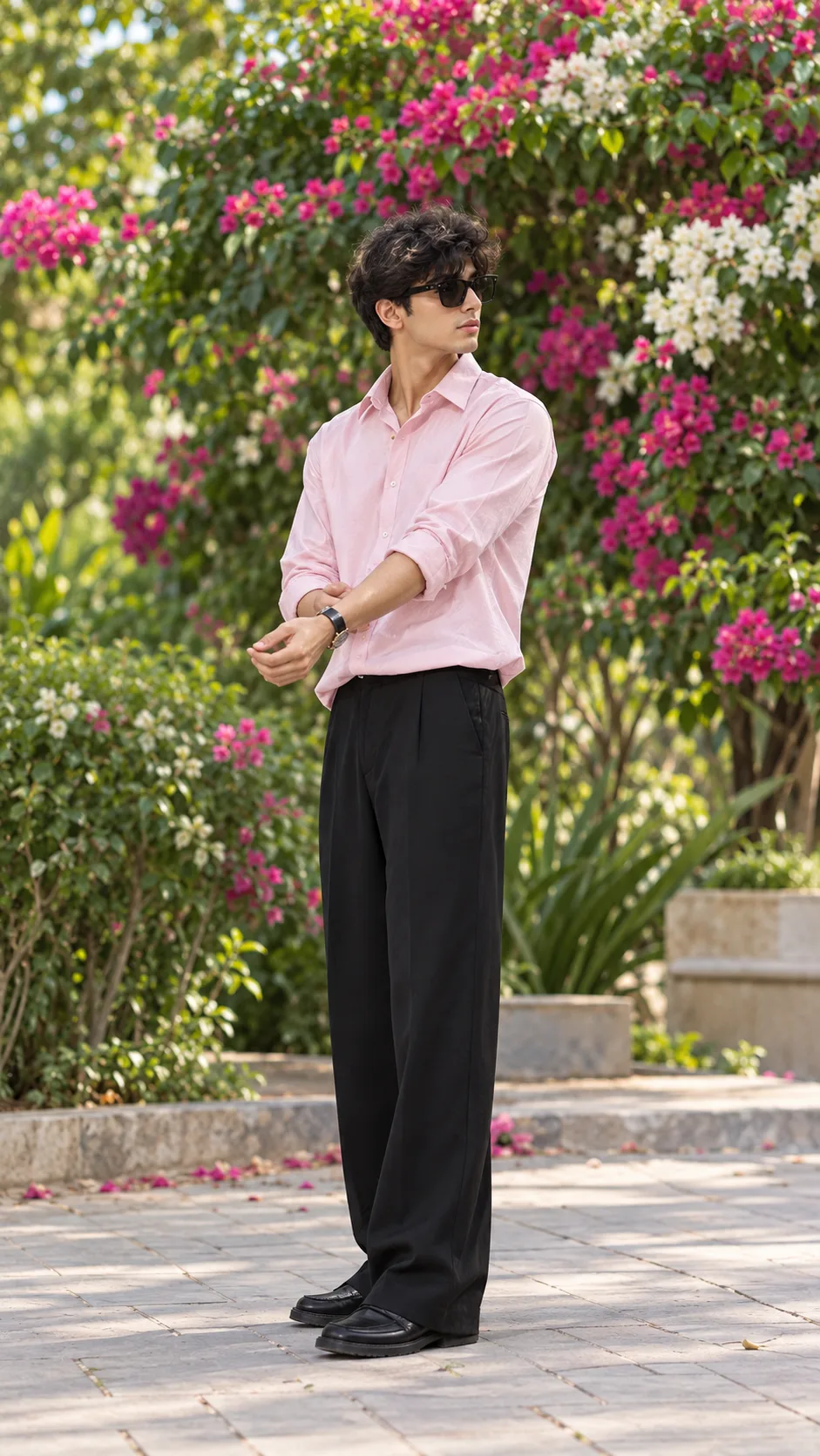 Casual Fashion Portrait of a Man Among Pink Bougainvillea Flowers